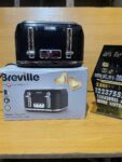 This is a Breville Curve Collection 4-slice toaster in black gloss.