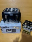 This is a Breville Curve Collection 4-slice toaster in black gloss.